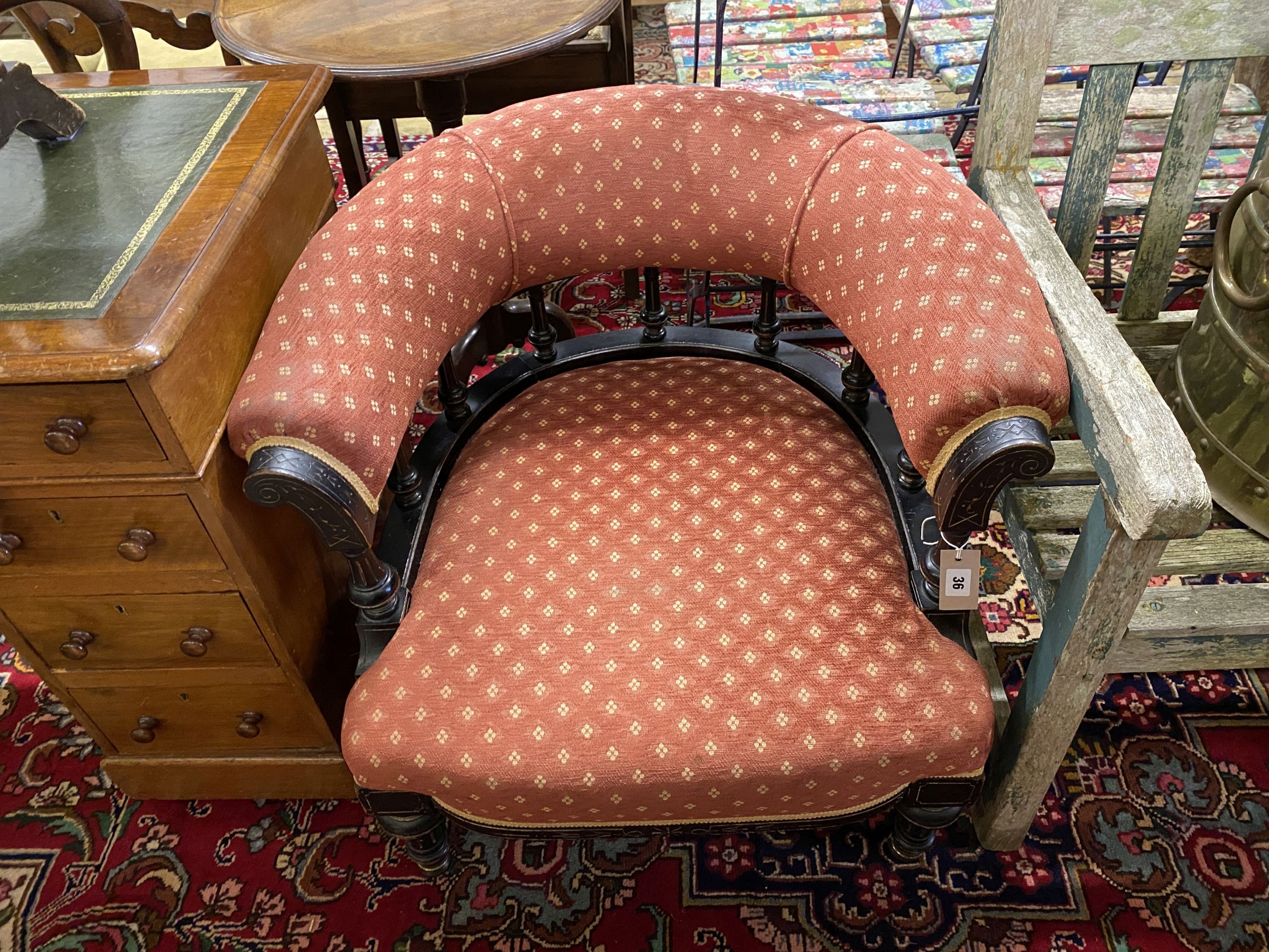 A late Victorian aesthetic movement ebonised tub framed chair, width 72cm, depth 64cm, height 66cm